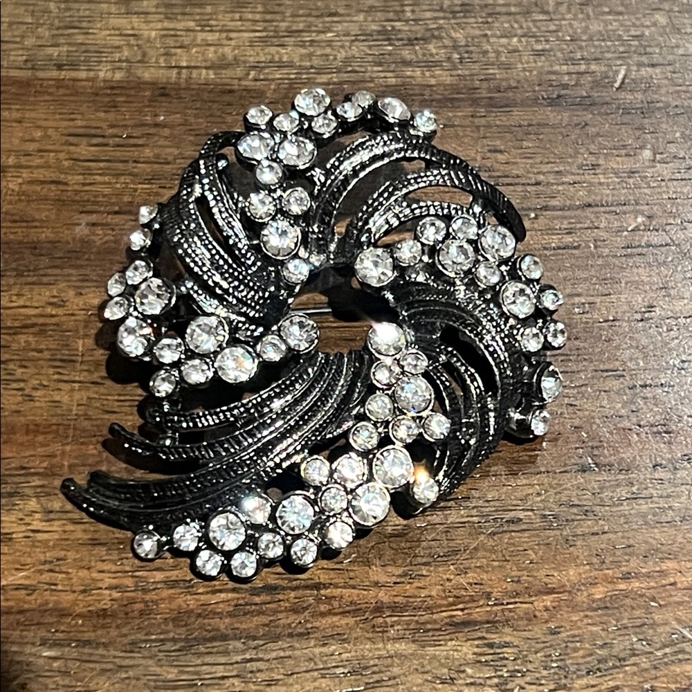 Vintage dark grey swirl and rhinestone brooch